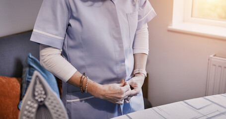 Hands, iron and getting ready with a person in the home for spring cleaning, housework or chores....