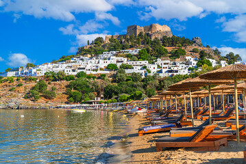 Lindos, Rhodes, Greece: Scenic view of Lindos Acropolis and beach on Rhodes island, Aegean Sea