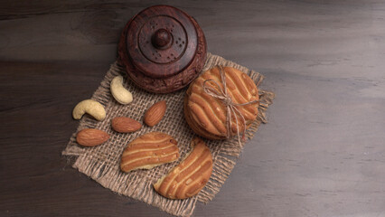 Tasty Cookies with sesame seeds on wooden board. Healthy vegan cookies.