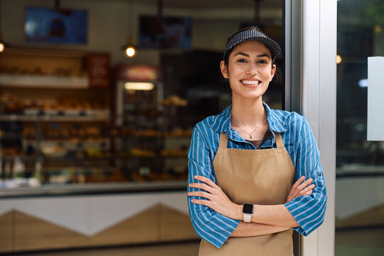 Portrait of confident female bakery owner looking at camera.