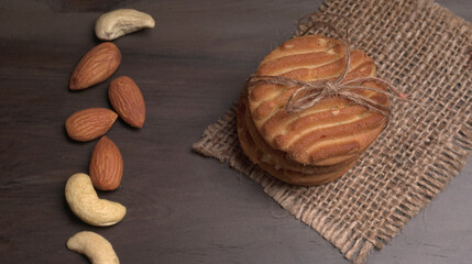 Tasty Cookies with sesame seeds on wooden board. Healthy vegan cookies.