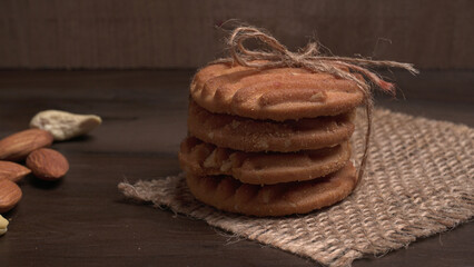 Tasty Cookies with sesame seeds on wooden board. Healthy vegan cookies.