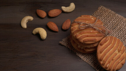 Tasty Cookies with sesame seeds on wooden board. Healthy vegan cookies.