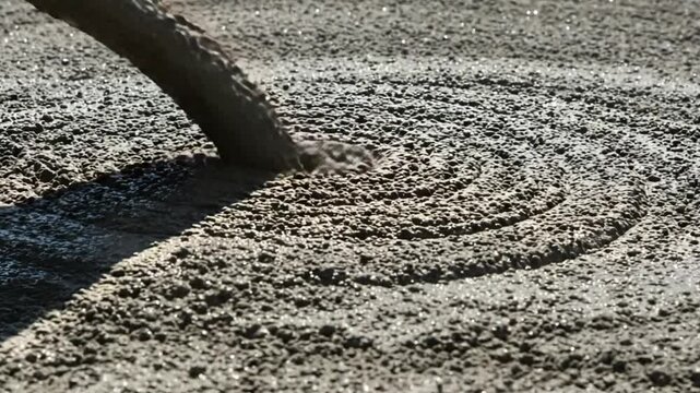Concrete Being Poured from Mixer Hose