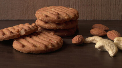 Tasty Cookies with sesame seeds on wooden board. Healthy vegan cookies.