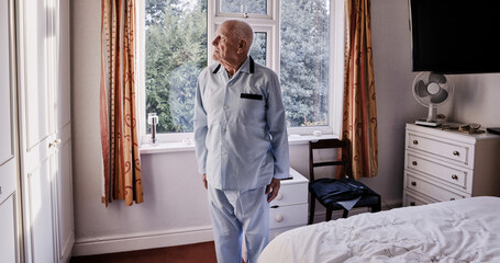 Morning, thinking and senior man in bedroom for wake up, start and getting ready for the day....