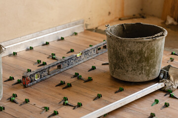 Working process, fixing tile on the floor. 