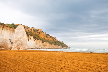 View of the Italian town of Vieste during a storm and cloudy weather. Sad atmosphere of the popular holiday destination Vieste.