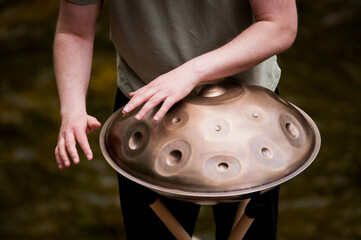 handpan outdoors near a waterfall