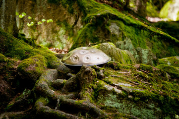 handpan outdoors near a waterfall