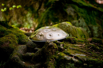 handpan outdoors near a waterfall