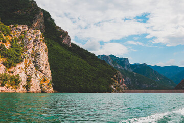 Fototapeta premium Emerald Serenity: Lake Koman's Majestic Peaks, Albania, Shkoder, Koman