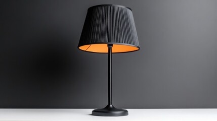 Modern black table lamp with orange interior light