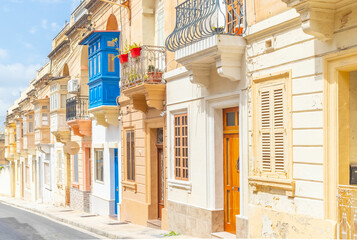 Typical Maltese street with old residential buildings in traditional architectural style, Malta