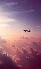 Fototapeta premium Soaring above clouds passenger airplane during twilight aerial journey through a dreamy pastel sky