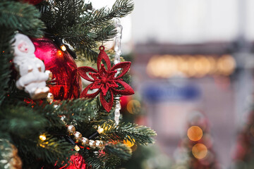 Beautiful holiday toys on the Christmas tree. Close-up. Beautiful Christmas background. The concept...