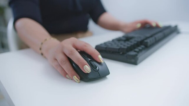 Customer Service Representative at Call Center Using Computer Mouse and Keyboard on White Desk in Office, Focusing on Professional and Efficient Support Call center Customer service representative