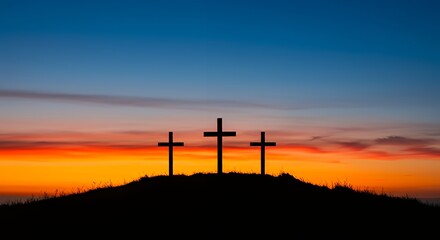 Three Crosses Silhouette on Hill Against Colorful Sky at Sunset