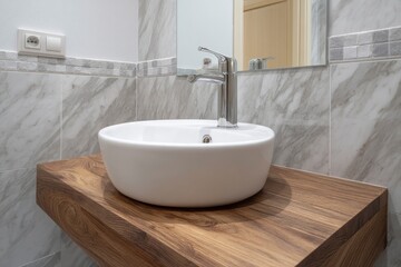 Fototapeta premium Bathroom Sink on Wooden Countertop