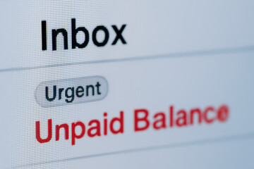 Urgent unpaid balance email in inbox warns about debt and possible eviction notice creating stressful financial situation for recipient