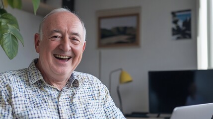 Portrait of a cheerful senior man working from home with a happy expression