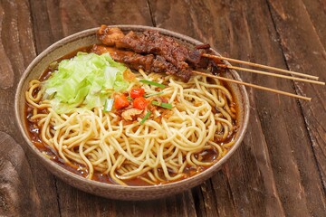 Mie Ongklok. Ongklok noodles are boiled noodles typical of the city of Wonosobo and. its surroundings. These boiled noodles are made using cabbage, chopped chives, and a thick, starchy sauce called lo