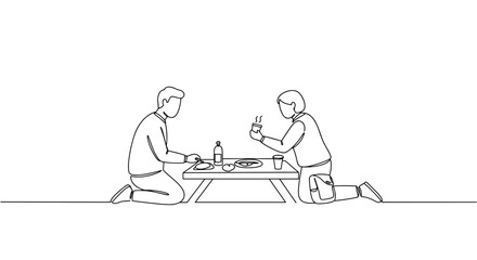 people enjoying a meal together at a picnic table  