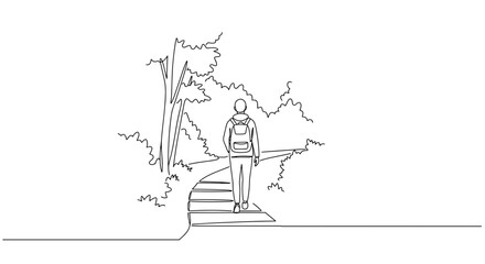 Obraz premium Person hiking on a trail in a serene forest landscape 