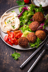 Salad with hummus, falafel and vegetables