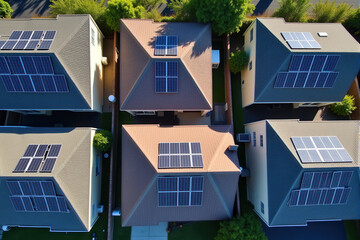 A bird's-eye view of a neighborhood with multiple houses, each featuring solar panels on their rooftops