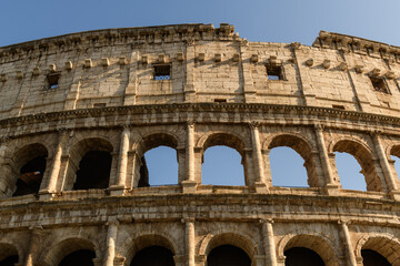 Obraz premium The Roman Colosseum ancient amphitheatre ruin in the center of Rome, Italy.