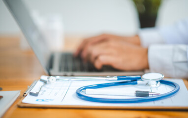 Stethoscope with clipboard on desk,Doctor Recommends Patient, Healthcare and medical concept.