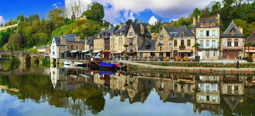 France travel, most scenic villages and towns of Brittany. Picturesque traditional port of Dinan with half-timbered houses, restaurants over canals