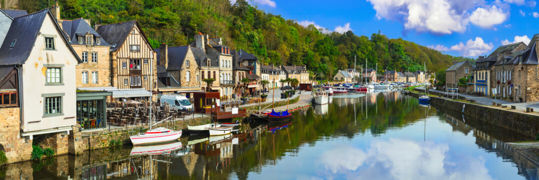 Dinan Brittany 16k panorama of picturesque traditional port with half-timbered houses reflected in water. Scenic medieval town view in France over Rance river. Breton most authentic villages