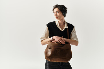 Stylish young man showcases modern fashion in contemporary studio setting
