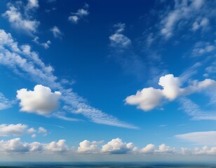 Fototapeta premium the sky is blue with a few clouds scattered throughout