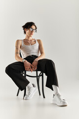 Modern fashion statement featuring a stylish young man in a minimalist studio setting