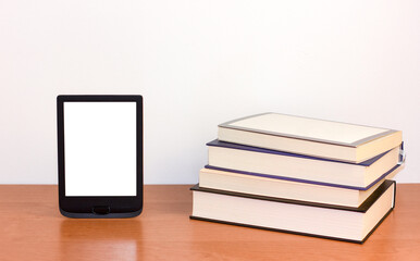 e-book and paper books on the table