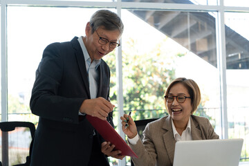 Senior businessmen analyzing data.