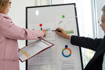 Senior businessmen analyzing data.