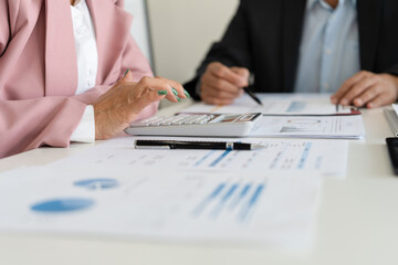 Senior businessmen calculating investment.