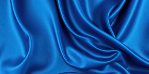 Obraz premium Luxurious Deep Blue Satin Fabric Draped in Elegant Folds for Design Inspiration