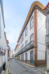 Traditional Azores street in Angra do Heroismo. Colorful houses in the capital of Terceira island. Portugal.