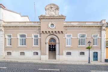 Fototapeta premium Elegant Neoclassical Building Facade in Angra do Heroismo, Azores, Portugal - Impressive Formal Architecture with Arched Entrance and Ornate Details in Vila de Angra do Heroismo, Azores, Portugal