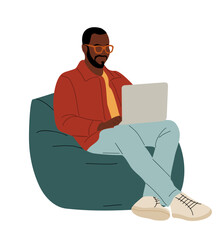 Black man in casual clothe sitting on bean bag armchair, working on laptop. Comfortable workplace, freelance concept. Colorful flat vector illustration isolated on transparent background