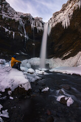 Snowed Kvernufoss waterfall in winter (Iceland)