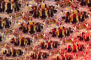 Detailed ornate ceiling with geometric and floral patterns in gold and red tones. Design showcases...