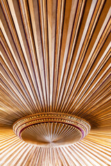 Detailed shot of an ornate ceiling featuring radial patterns and intricate gold detailing. Ottoman craftsmanship