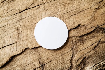 Close-up of weathered wooden surface with round white circle, knots, and rough texture. Top-down perspective on light brown background