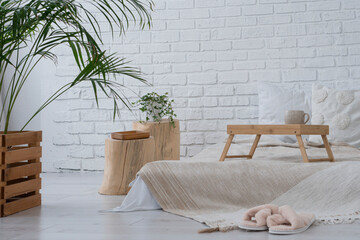 Cozy home interior in neutral colors and green plants